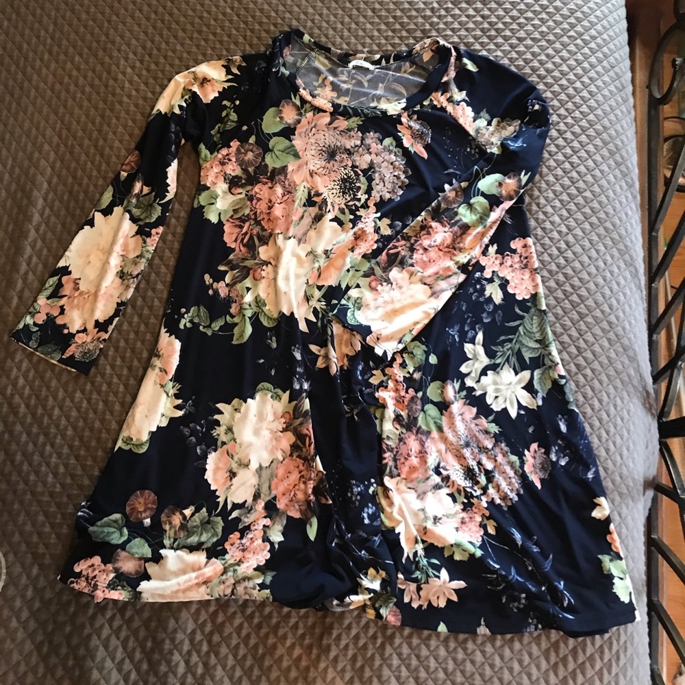 Floral print dress comes above the knee.